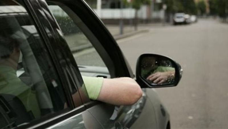 Drivers with Their Hands Hanging Outside the Window