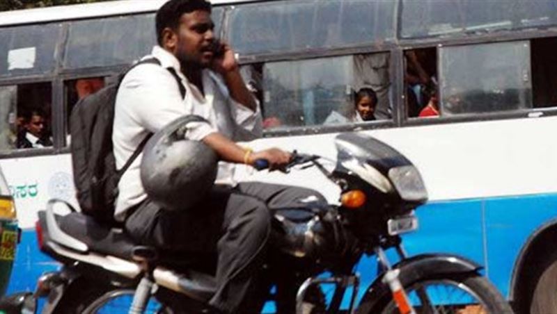 Biker No Helmet Texting on the Phone