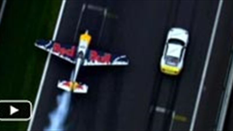 Porsche GT3 racing a plane
